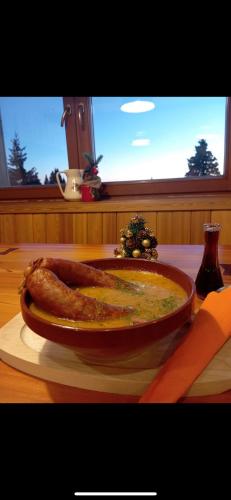 a plate of food on top of a table at DOMŽALSKI DOM na Veliki Planini in Stahovica