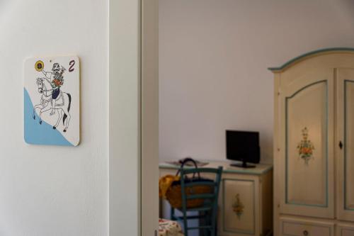 a switch on a wall next to a desk at A' Cavalera in San Vito lo Capo