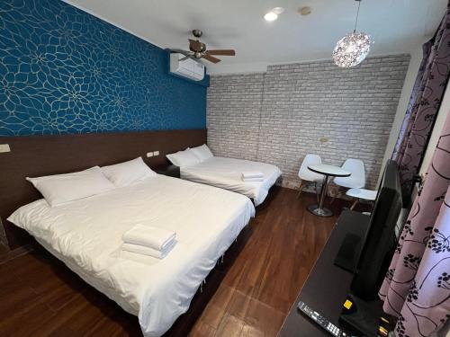 Llit o llits en una habitació de 藍晴庭