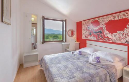 a bedroom with a large bed and a window at Villa Ivka-Omis by Villas Guide in Katuni