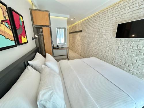 Postel nebo postele na pokoji v ubytování Fitas Oda Hotel