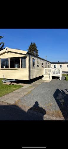 a large house with a lot of windows on it at 75 Lakeside East Haggerston Castle Park in Cheswick