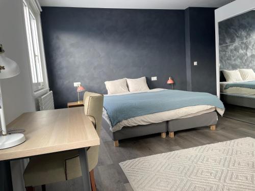 a bedroom with a bed and a desk and a desk at Vermont Hub for Offsites, Retreats & Individual Bookings in Alps in Leysin