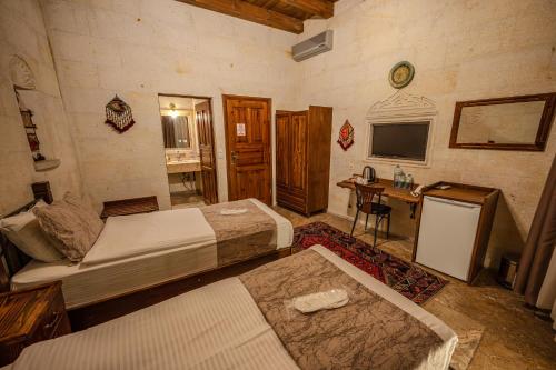 Letto o letti in una camera di Osmanbey Cave House