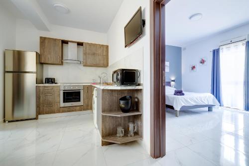 Una cocina o cocineta en Sir William Reid Apartments