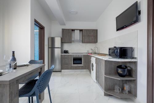 Una cocina o cocineta en Sir William Reid Apartments