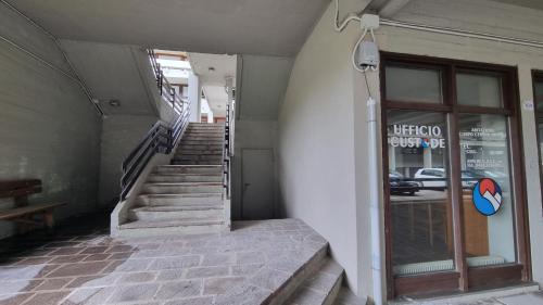 a stairway leading to a building with a window at Ruscello Alpino in Mazzin