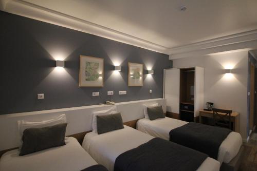 Katil atau katil-katil dalam bilik di Imperador Hotel