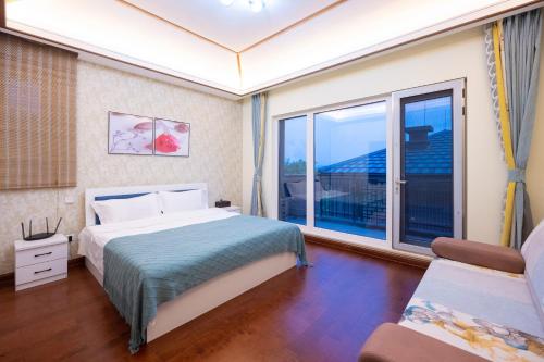 Katil atau katil-katil dalam bilik di Dream Back Great Wall Boutique Villas in Beijing's Gubei Water Town