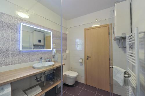 Ванная комната в Luka Residence Apartments 1