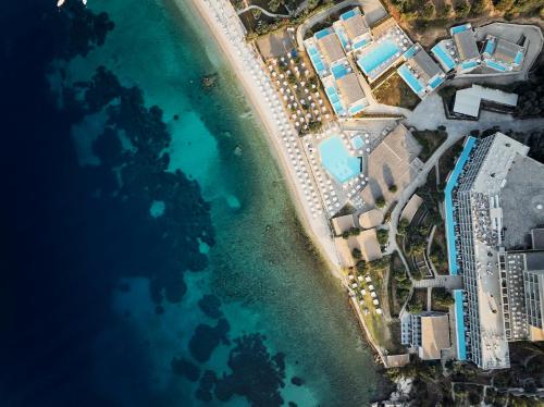 an aerial view of the beach and the ocean at Atlantica Nissaki Beach - Adults Only in Gimari