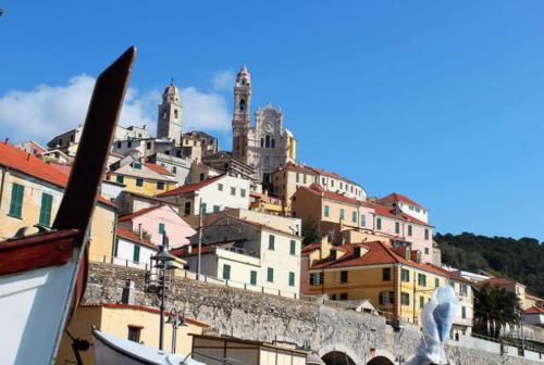 a view of a city with a mountain at La Suite in Cervo