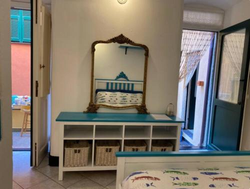 a dressing table with a mirror on the wall at La Suite in Cervo