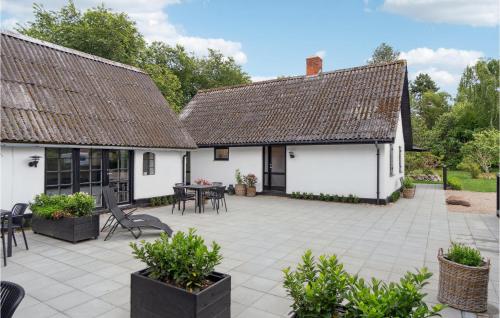 an external view of a house with a patio at Lovely Home In Nykøbing Sj With Kitchen in Nykøbing Sjælland