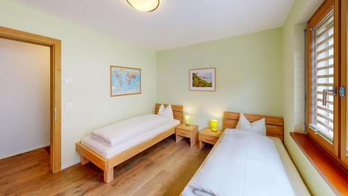 Postel nebo postele na pokoji v ubytování Edelweiss Lanezzi