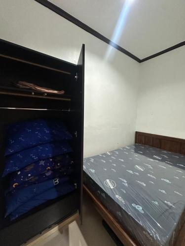 a small bedroom with a bunk bed in it at A and A Homestay Tandag City 