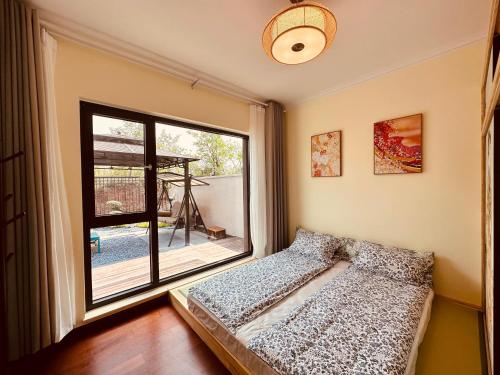 Katil atau katil-katil dalam bilik di Dream Back Great Wall Boutique Villas in Beijing's Gubei Water Town