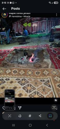 a screenshot of a video game with a fire pit at Maple forest park cabins in Sākib