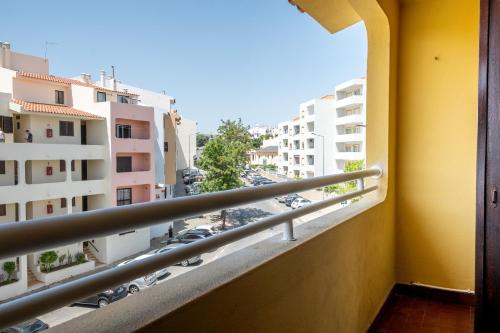 a balcony with a view of a parking lot at Bellavista Avenida By BeGuest in Albufeira