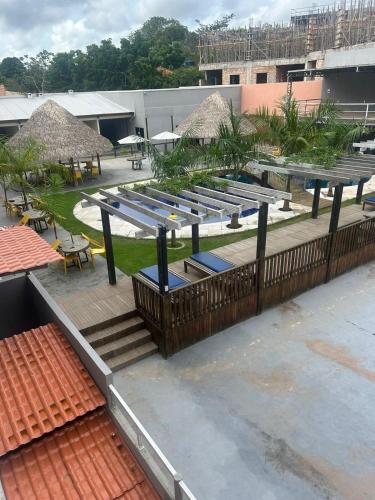 a group of benches sitting on top of a building at Alter Beach Flat in Alter do Chao