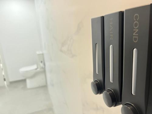 a close up of a door in a bathroom at Mistral Suites in Valencia