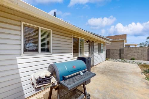 a bbq on a grill outside of a house at The Cozy Pines Getaway in Show Low