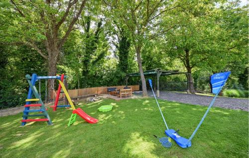 a yard with a playground with a swing at Gorgeous Home In Bjelovar 