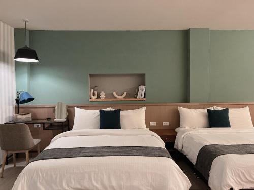 Ένα ή περισσότερα κρεβάτια σε δωμάτιο στο Minilove Homestay