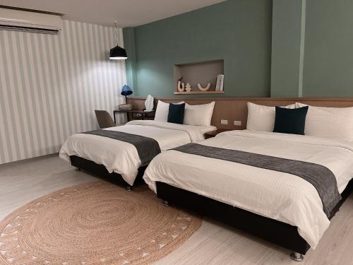 Ένα ή περισσότερα κρεβάτια σε δωμάτιο στο Minilove Homestay