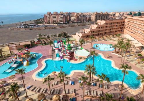 an aerial view of a pool at a resort at ALEGRIA Colonial Mar Aquafun in Roquetas de Mar