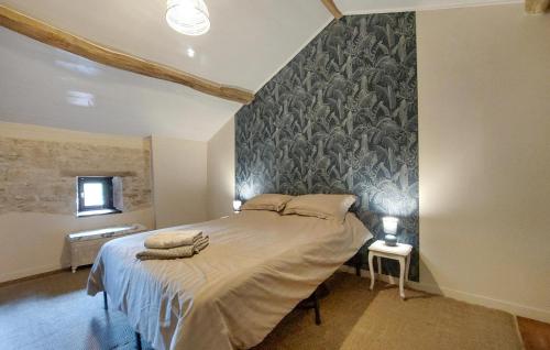 a bedroom with a bed and a wall mural at Holiday Home On A Vineyard in Savigné