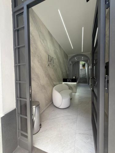 a bathroom with a white tub sitting in a room at Palazzo Valentino in Naples