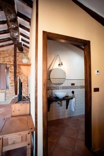 a bathroom with a sink and a mirror at L'Olivera - BENABARRE in Benabarre
