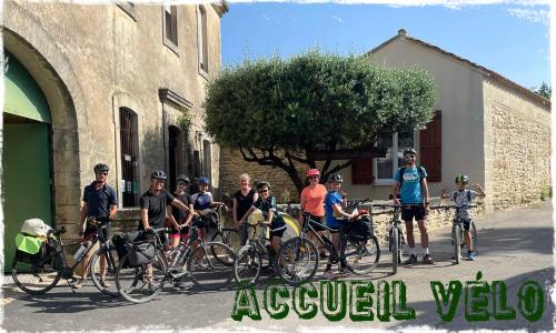 a group of people standing with bikes in front of a building at Les Gîtes sous l' Olivier en Camargue in Vauvert