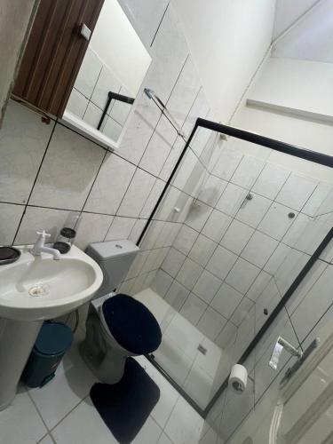 a bathroom with a shower and a toilet and a sink at Orla Flats - Apartamento 04 in Bragança