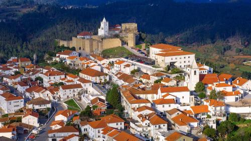 an aerial view of a town with a castle at Casa da Torre in Penela