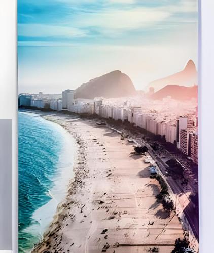 a view of a beach with buildings and the ocean at Casa Maua in Rio de Janeiro