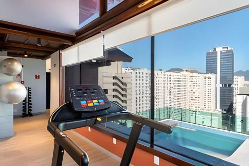 a gym with a view of the city at Casa Maua in Rio de Janeiro