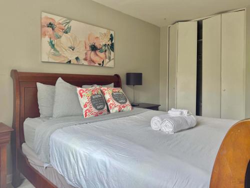 a bedroom with a white bed with towels on it at Heart Downtown 2BD NEW Paint floor CITY View LM207 in Atlanta