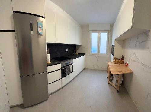 Habitación cerca del centro, baño y cocina compartida
