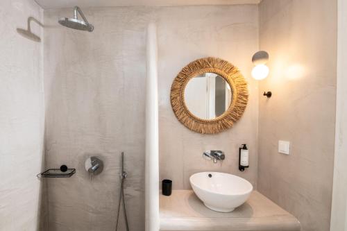a bathroom with a sink and a mirror at Elements Villas in Lardos