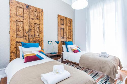 Postel nebo postele na pokoji v ubytování Lisbon Guests Apartments