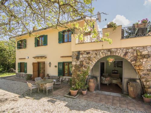 an external view of a house with an archway at Holiday Home Allumiere by Interhome in Allumiere