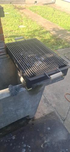 a black grill sitting on the side of a street at Apartman Marija in Kladovo