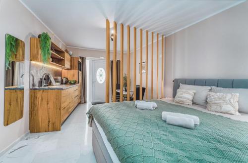 a bedroom with a large bed with two pillows on it at SAMM Apartments Šibenik in Šibenik