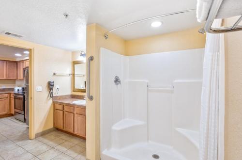 a bathroom with a shower and a sink at Vacation Village at Parkway in Orlando