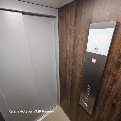 a room with a walk in shower with a glass door at Studio Râșnov VMP Free Parking in Râşnov