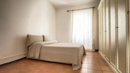 Кровать или кровати в номере Acqua e sale - Anzio centro