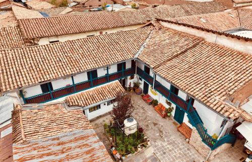 an overhead view of a building with tiled roofs at La Estación San Pedro in Cusco