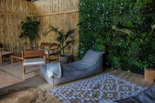 a couch sitting on a patio next to a plant at Agriturismo Bonaventura in Montefiascone